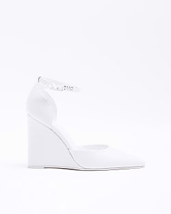 White heeled wedge shoes