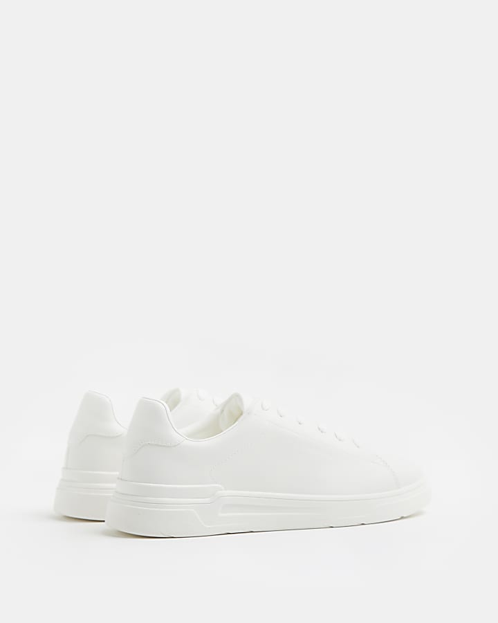 White lace up cupsole trainers