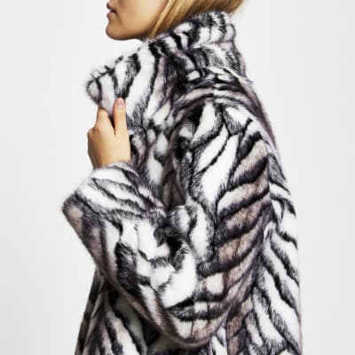 White long line faux fur zebra print coat | River Island