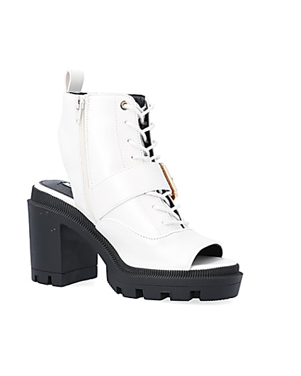 360 degree animation of product White open toe heeled ankle boots frame-17