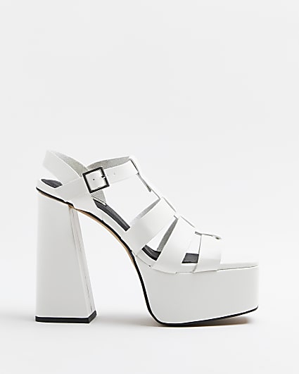 White platform heeled sandals