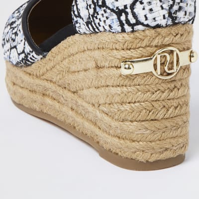 White RI monogram boucle wedges