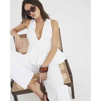 White Sleeveless Textured Plunge Peplum Top