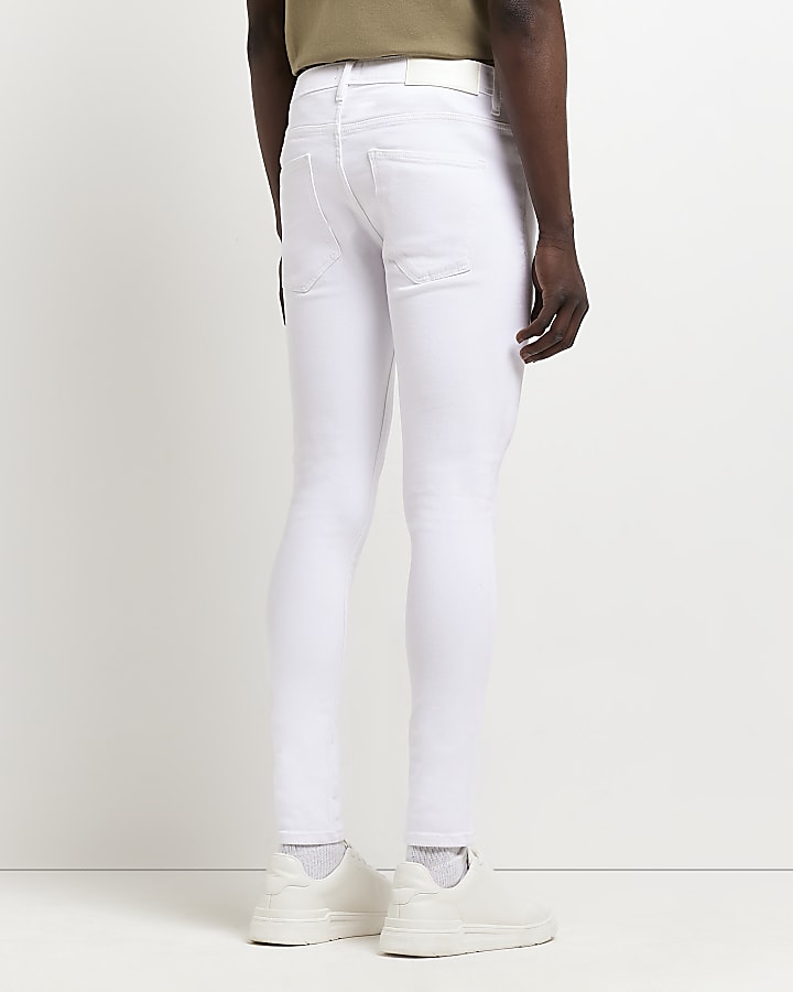 White spray on skinny fit jeans