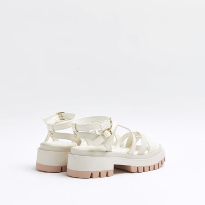 white strappy flatforms