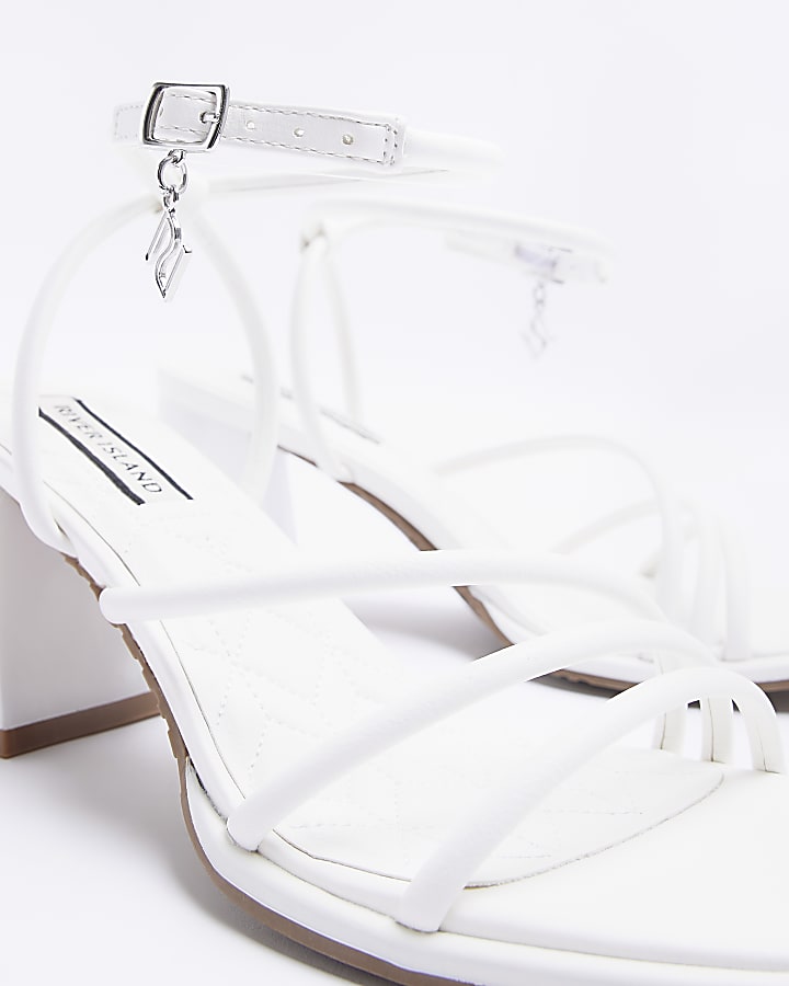 White strappy heeled sandals