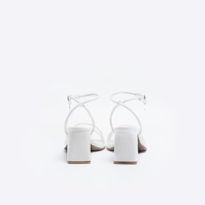 White strappy heeled sandals
