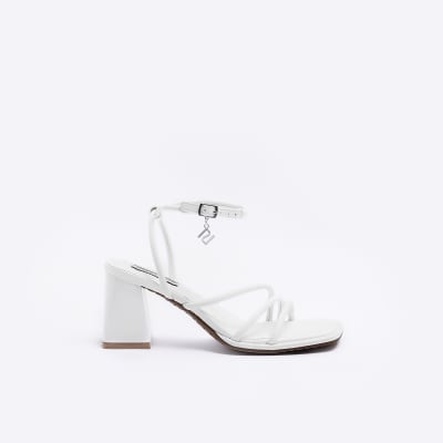 White strappy heeled sandals