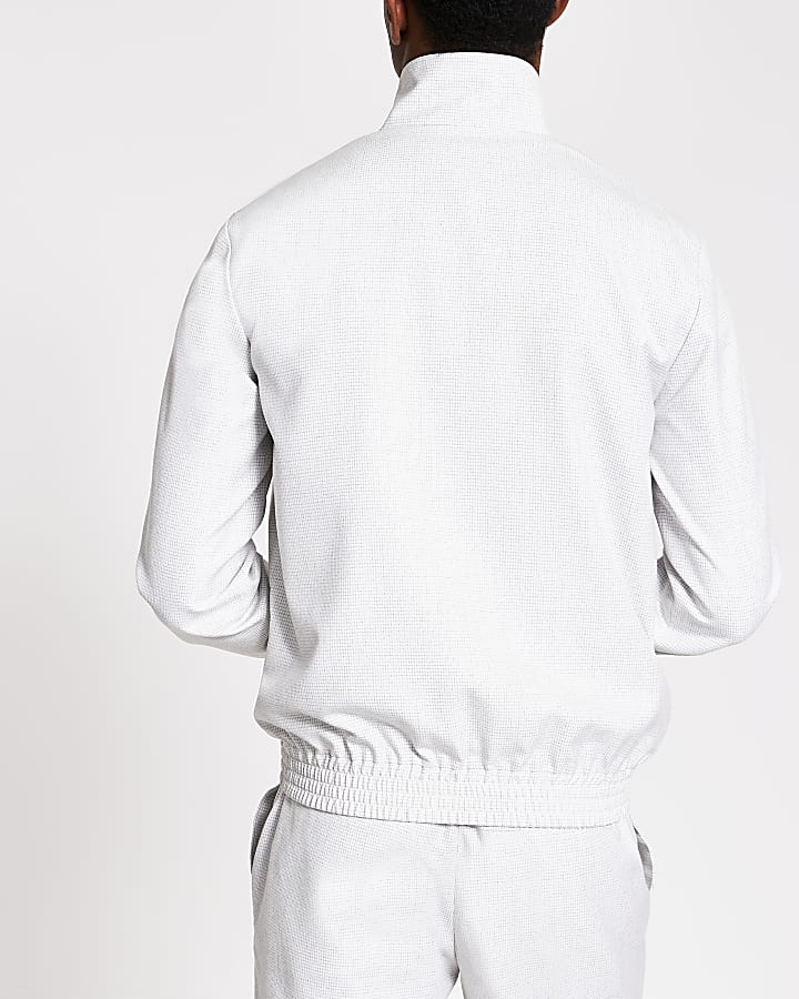 White textured zip front funnel neck jacket