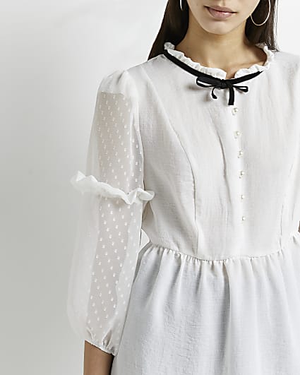White tie neck peplum blouse