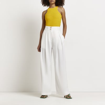 white pleated wide leg trousers