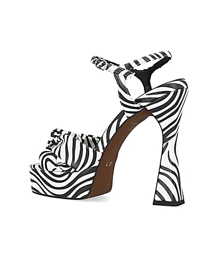 360 degree animation of product White zebra print knot detail platform heels frame-5