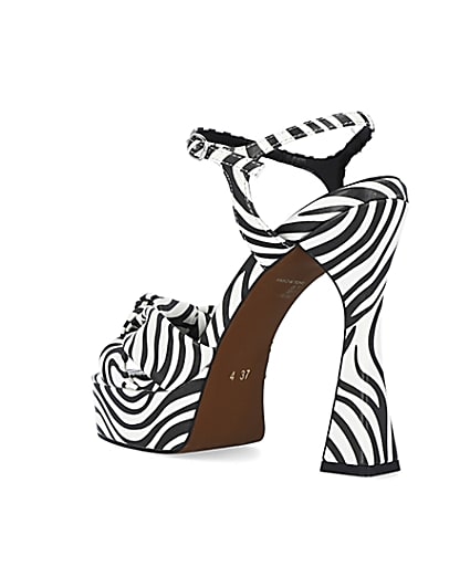 360 degree animation of product White zebra print knot detail platform heels frame-6