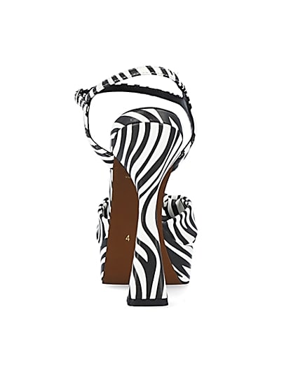 360 degree animation of product White zebra print knot detail platform heels frame-9