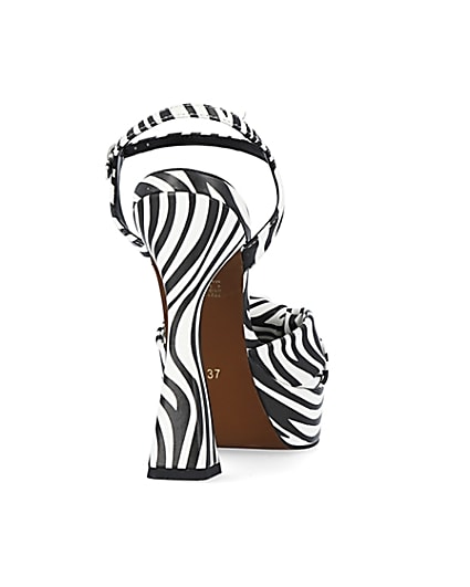 360 degree animation of product White zebra print knot detail platform heels frame-10