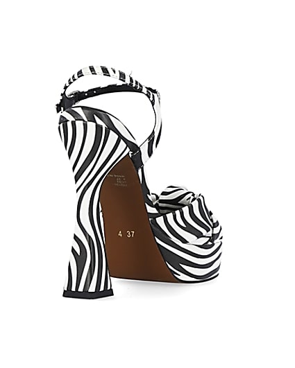 360 degree animation of product White zebra print knot detail platform heels frame-11