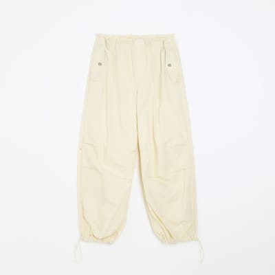 Yellow baggy low rise parachute trousers | River Island