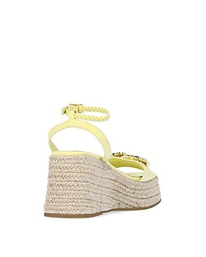 360 degree animation of product Yellow chain detail flatform wedges frame-11