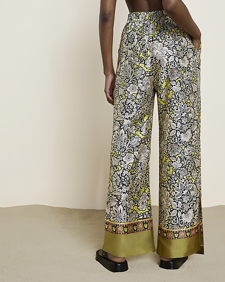 Yellow floral pleated wide leg trousers