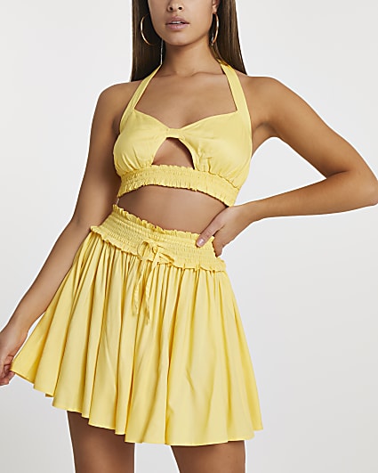 Yellow halter cut out crop top