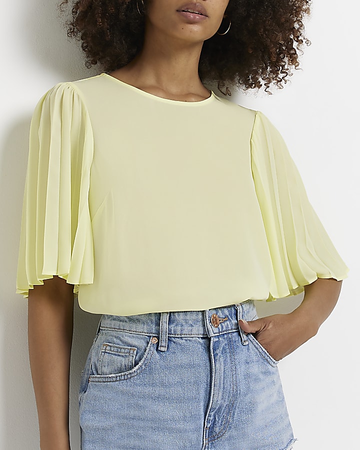 Yellow pleated blouse