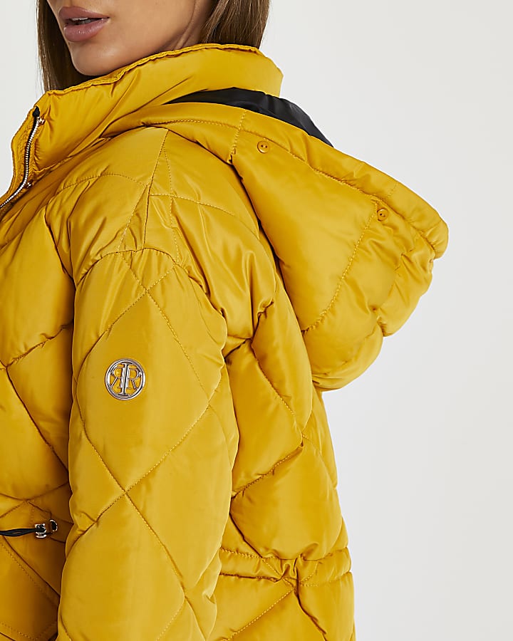 Yellow quilted puffer coat