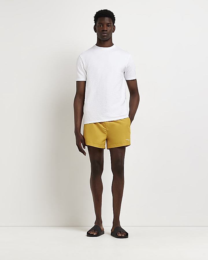 Yellow skinny fit swim shorts