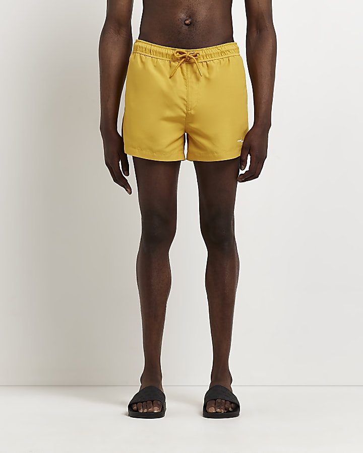 Yellow skinny fit swim shorts