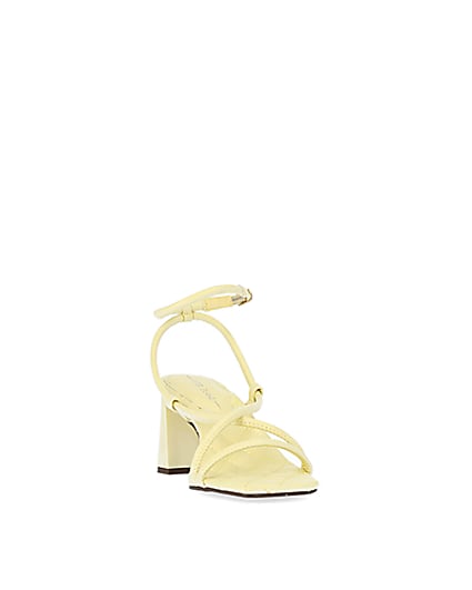 360 degree animation of product Yellow strappy heeled sandals frame-20