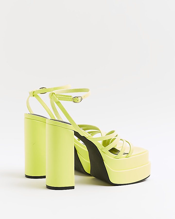 Yellow strappy platform heeled sandals